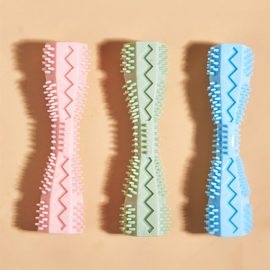 Pink textured dog chew toy with nubs and ridges for teeth cleaning, designed like a stick with a hollow center. - Image 2