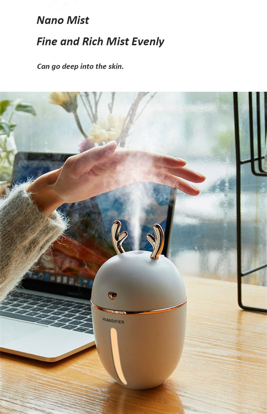 Pink deer-shaped ultrasonic humidifier with gold antlers, a white USB fan, and a white USB light. - Image 2