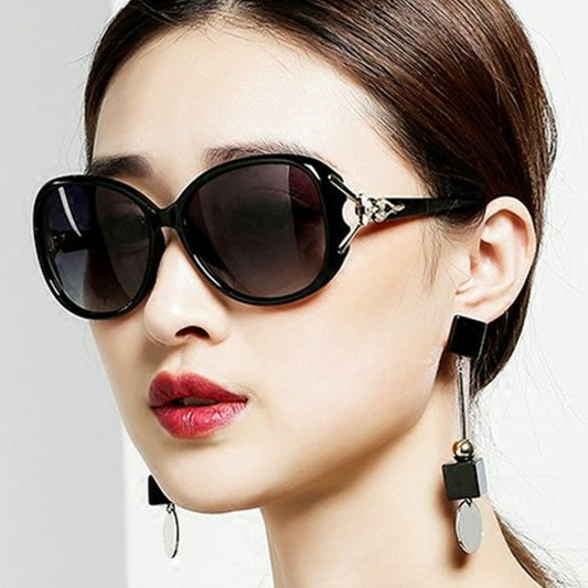 Brown oversized women's sunglasses with gradient lenses and gold-tone fox head embellishments on the temples. - Image 2