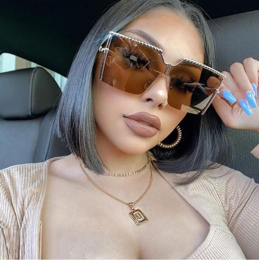 Frameless conjoined sunglasses with gold metal frame and braided detail, featuring brown gradient lenses. - Image 2