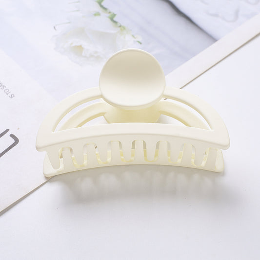 Frosted light blue rectangular hair claw clip with a gold-toned spring mechanism, ideal for securing hair. - Image 2
