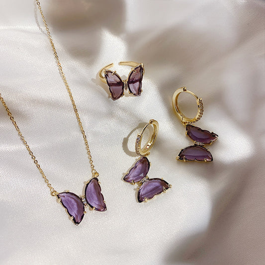 Aretes, Anillo y Collar de Cristal Púrpura con Diseño de Mariposa - Image 2