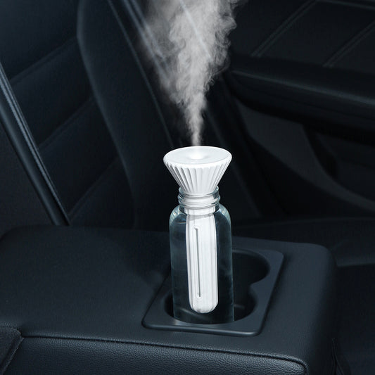 Beige and white USB ultrasonic humidifier with a fluted conical top and a cylindrical body with a water level window. - Image 2