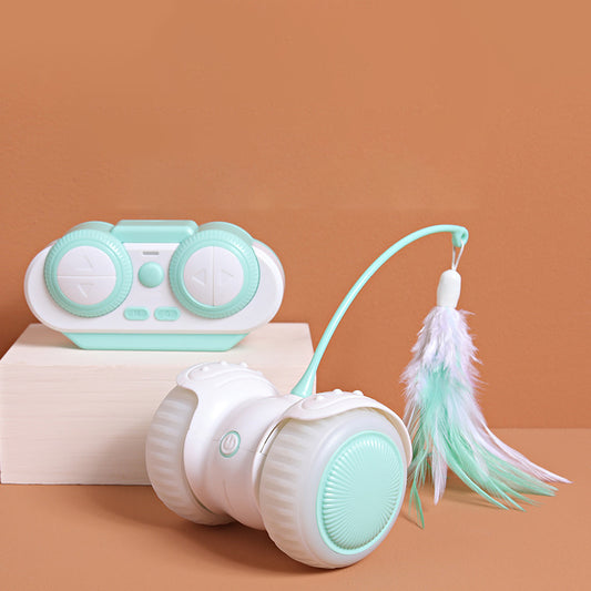 White and mint green remote control cat toy with a feather wand and bell, shown with remote, USB cable, and batteries. - Image 2