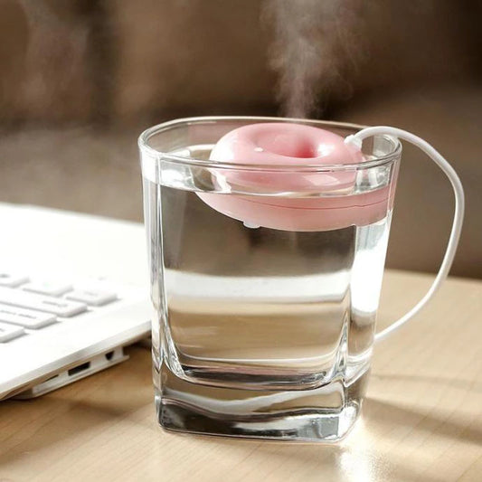 Bright blue donut-shaped mini portable USB air humidifier purifier with a white central filter and silver button. - Image 2