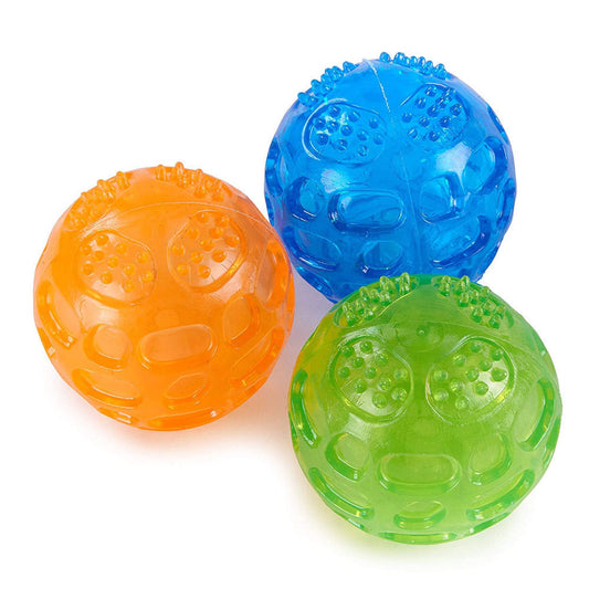 Orange rubber pet toy ball with an openwork design and textured nubs, ideal for puppies' biting and molars. - Image 2