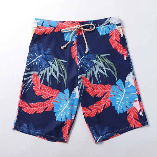 Women's three-piece swimsuit set with a navy blue tropical leaf print bikini and matching off-the-shoulder cover-up. - Image 2