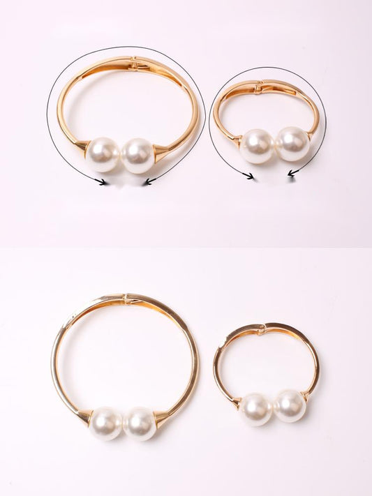 Gold alloy curtain tie-back with two large white faux pearls holding back a teal woven curtain. - Image 2