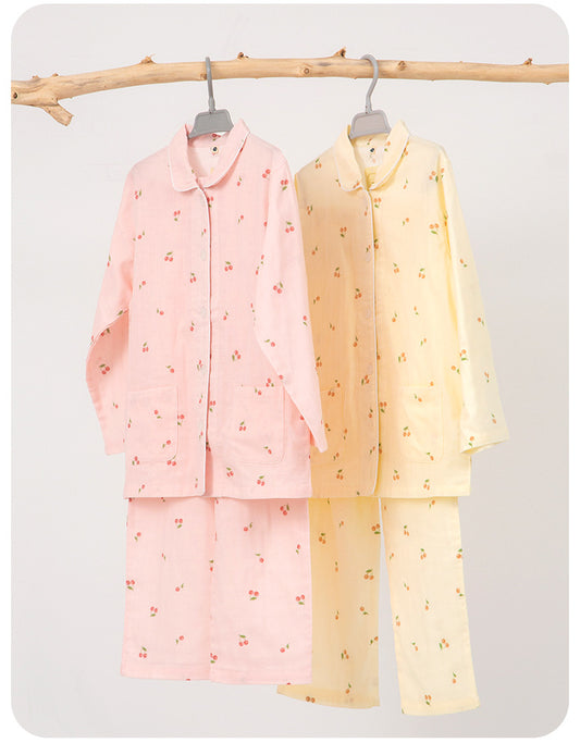 Pink long-sleeved pajama set for children with an all-over cherry print, Peter Pan collar, and matching pants. - Image 2