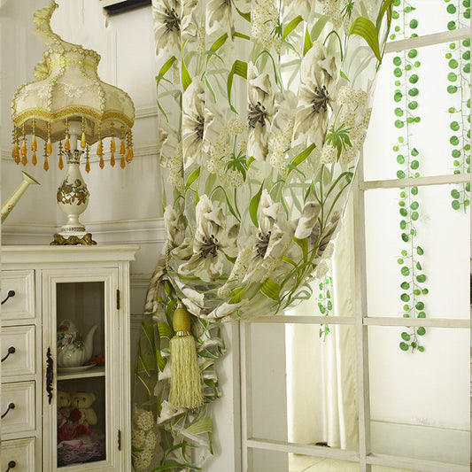 White sheer curtains with a green and beige floral pattern, hanging on a rod in a bright room. - Image 2