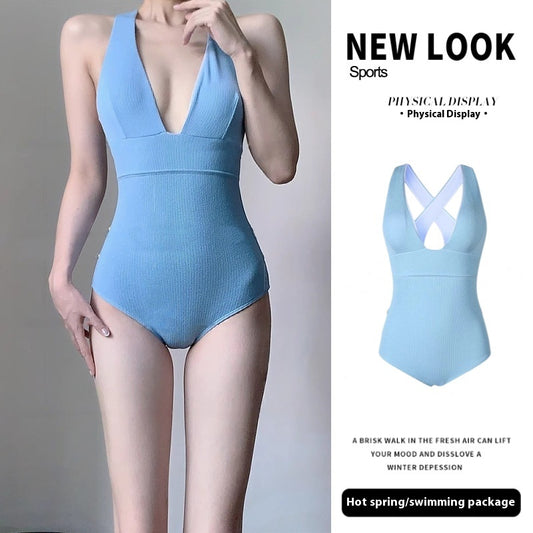Light blue ribbed one-piece swimsuit with a deep V-neck and halter straps, modeled on a person. - Image 2