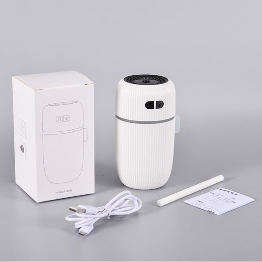 Black ribbed white noise humidifier with control buttons on top, designed to aid sleep and humidify. - Image 2