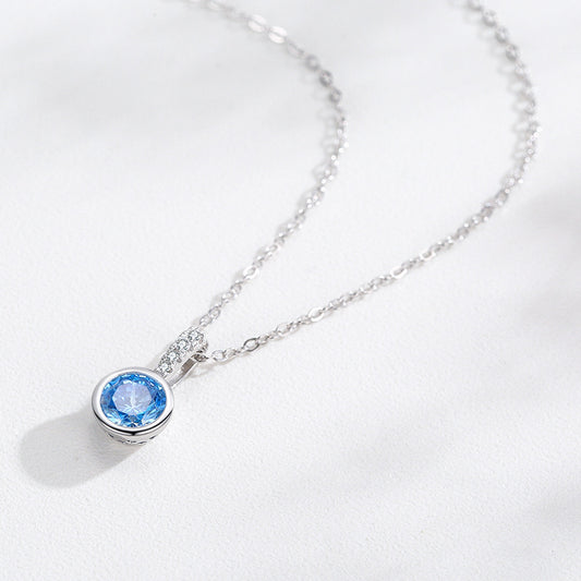 Women's light luxury jewelry set with a silver-toned necklace and hoop earrings, each featuring a sea blue artificial diamond pendant and clear artificial diamo - Image 2