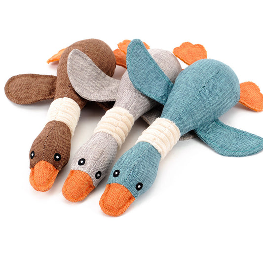 Plush teal duck dog toy with orange beak and feet, and a white ribbed neck, designed for sounding and puzzling. - Image 2