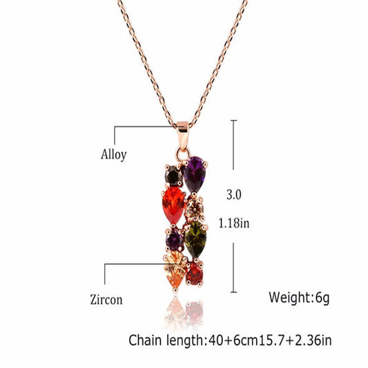 Shiny rose gold-tone necklace, earrings, and ring set with multi-colored teardrop and round zircon stones. Ring size 9. - Image 2