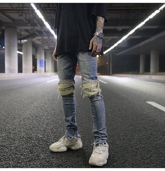 Jeans ajustados con rotos diseñados - Image 2