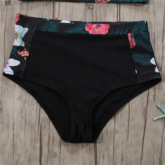 Black high-neck halter bikini top and high-waisted bottoms with pink and white floral leaf print. - Image 2