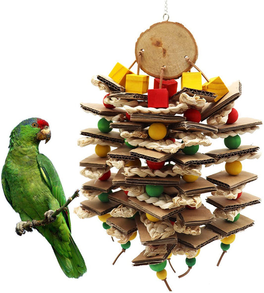Parrot gnawing toy made of stacked cardboard, corn husks, and colorful wooden beads, with a parrot perched nearby. - Image 2