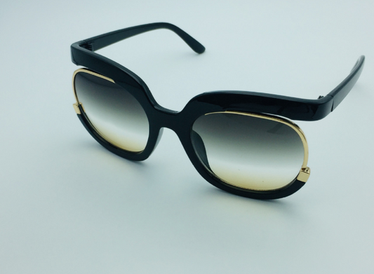 Black cat-eye half-frame sunglasses with gold accents and purple-grey gradient lenses, shown from front and side. - Image 2
