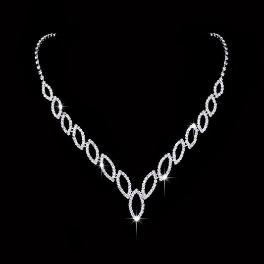 Sparkling silver-tone necklace and dangle earrings set with marquise-shaped rhinestone links for weddings or formal events. - Image 2