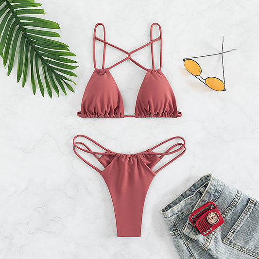 Red bean paste women's bikini swimwear with a triangle top and high-cut double-strap bottoms, laid flat. - Image 2