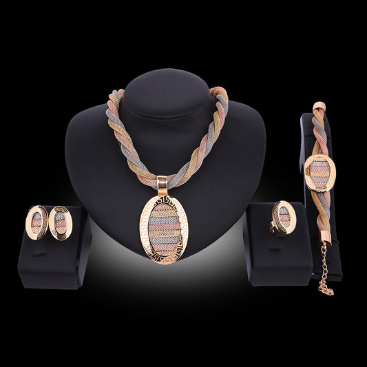 Four-piece jewelry set with tri-color braided necklace, earrings, bracelet, and ring. Each piece features an oval design with a Greek key border and striped gol - Image 2