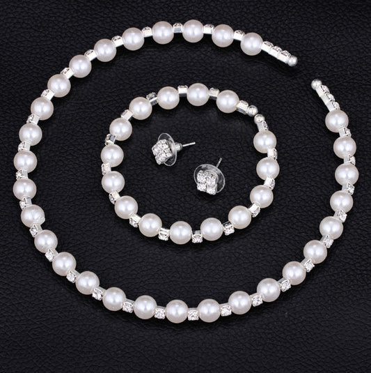 Bridal three-piece jewelry set with white pearls and clear rhinestones, including a necklace, bracelet, and square stud earrings. - Image 2