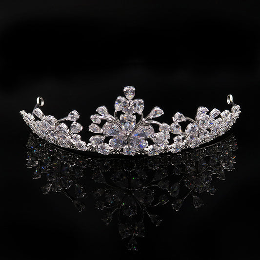 Sparkling bridal jewelry set with a silver-tone crown, necklace, and teardrop earrings, adorned with clear crystals. - Image 2