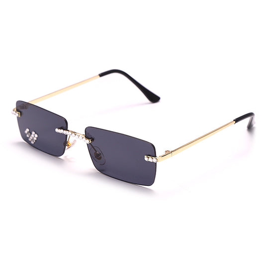 Frameless rectangular sunglasses with pink gradient lenses, gold-tone metal arms, and rhinestone embellishments. - Image 2