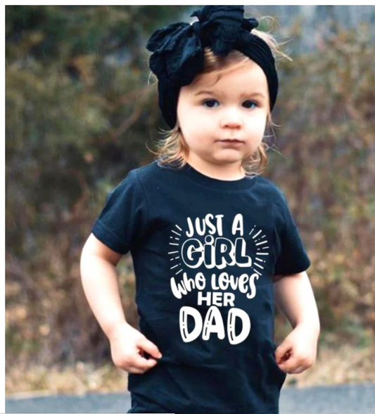 Black cotton t-shirt for dad with pink "JUST A DAD who loves HIS GIRL" text and matching baby onesie. - Image 2
