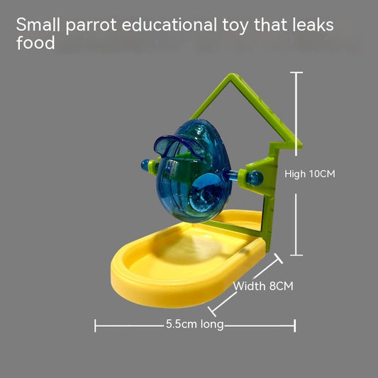 Small blue, yellow, and green parrot food leakage toy with a rotating dispenser and catch tray. - Image 2
