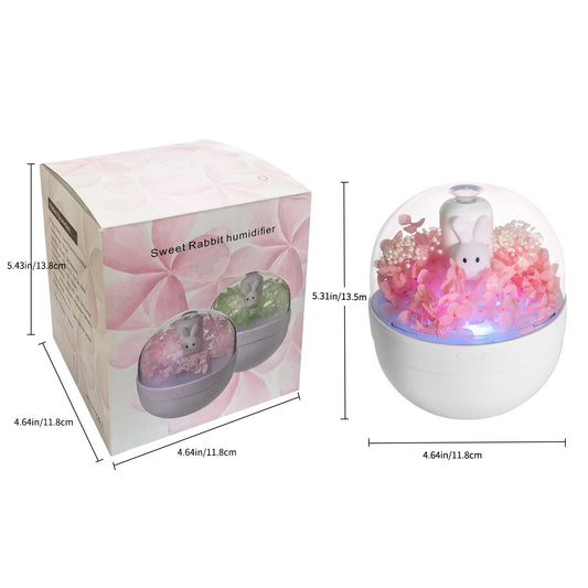 White rabbit preserved flower aromatherapy humidifier with pink flowers and blue light under a clear dome. - Image 2