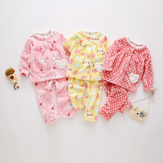 Pink flannel girls' pajamas with seashell and starfish patterns, featuring a button-up top and matching pants. - Image 2