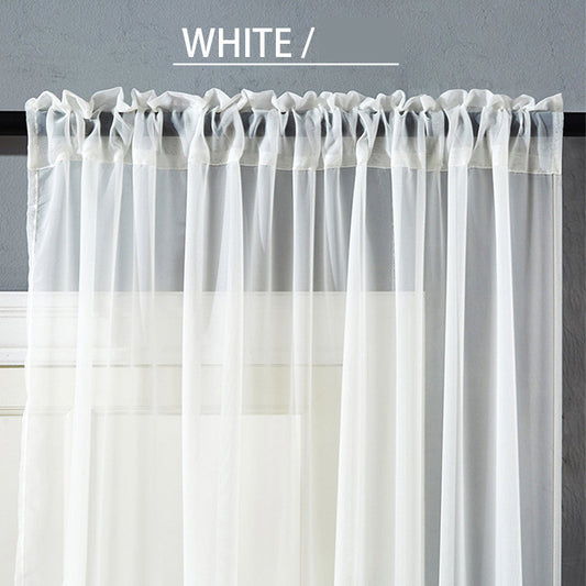 Sheer pink rod pocket curtain hanging on a black curtain rod, offering light transmission for a modern room. - Image 2