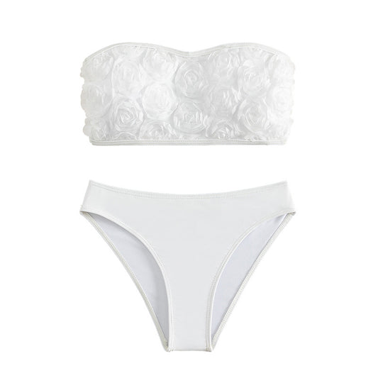 White tube top bikini swimsuit with 3D floral appliques and high-waisted bottom, modeled on a person. - Image 2