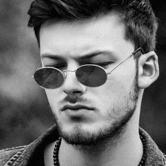 Retro round sunglasses with pink lenses and a gold-colored metal frame, featuring black ear tips. - Image 2