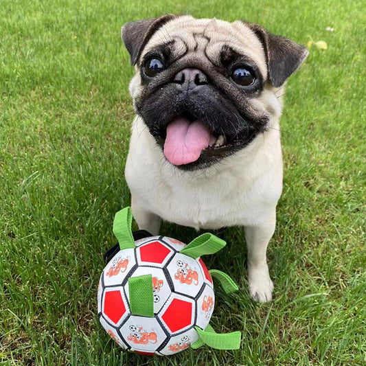 Red and white dog football toy with green fabric loops, featuring cartoon dogs playing with a soccer ball. - Image 2