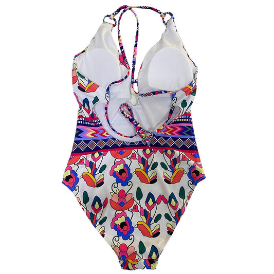 Vibrant floral and geometric one-piece swimsuit with a V-neck, keyhole detail, and criss-cross back straps. - Image 2