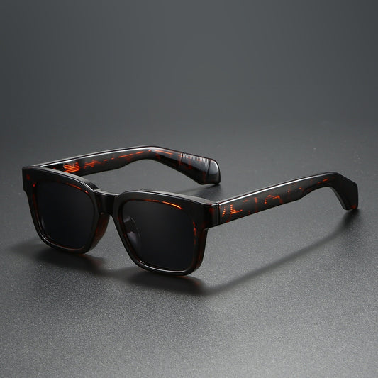 Black square-frame sunglasses with bright orange polarized lenses, designed for outdoor driving and anti-glare. - Image 2