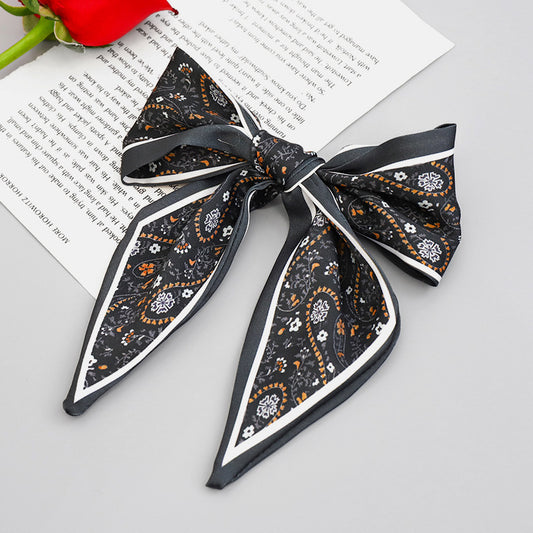 Clip Primavera para Coleta con Moño de Tela Estampada - Accesorio para Cabello Elegante - Image 2