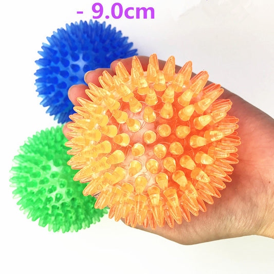 Red spiky TPR ball, a durable and bouncy toy for large dogs, designed for play and massage. - Image 2