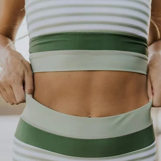 Women's striped bikini swimsuit with a racerback top and high-waisted bottom, featuring green and light green color-blocked bands. - Image 2