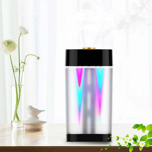 Modern cylindrical USB aroma humidifier with a metallic silver body, white top and base, and a gold mist outlet. - Image 2