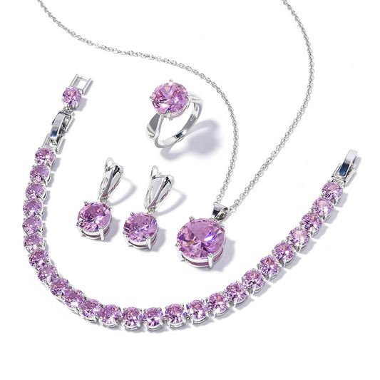 Four-piece jewelry set with silver-toned metal and round deep pink gemstones, including a necklace, bracelet, ring, and earrings. - Image 2