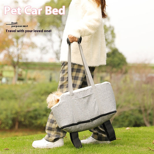 Grey pet car seat with plush white lining, designed for small dogs or cats, placed on a car's center console. - Image 2