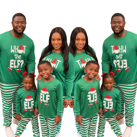 Family of four wearing matching green long-sleeve Christmas pajamas with "ELF" and striped pants. - Image 2