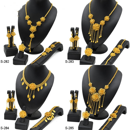 Gold-plated jewelry set with filigree flower designs, including a necklace with dangling chains, matching earrings, a ring, and a bracelet. - Image 2
