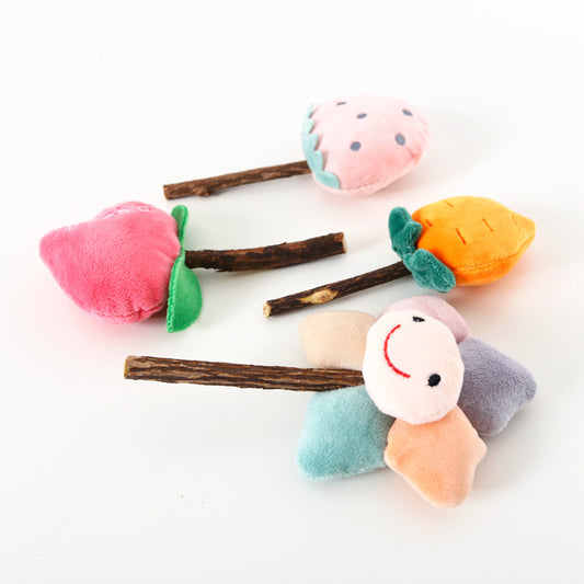 Plush carrot-shaped cat molar stick with green leaves on a natural wood stick, designed for pet play. - Image 2