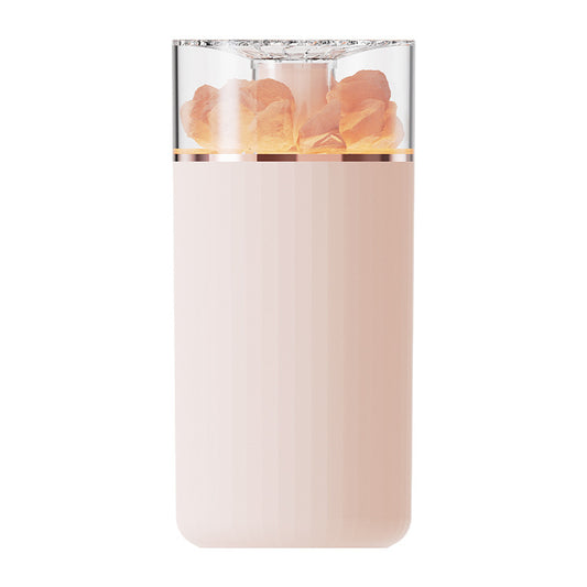 White portable aromatherapy humidifier with a clear top section displaying glowing pink salt crystals and a silver band. - Image 2