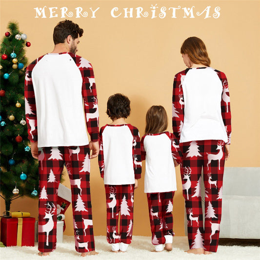 Women's Christmas pajama set with white raglan top featuring a red plaid deer head and matching red plaid pants with deer and trees. - Image 2